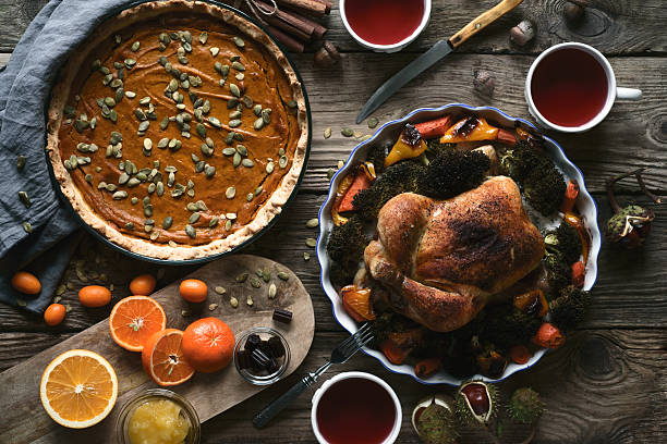 Wooden table served for Thanksgiving dinner top view