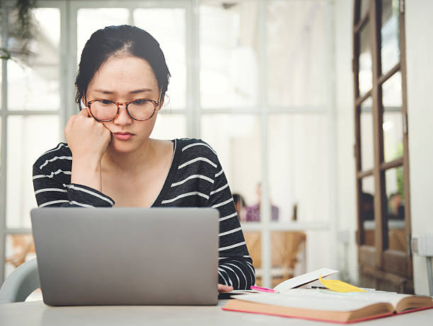 istock Woman Laptop Searching Research Connection Technology Concept 612030394