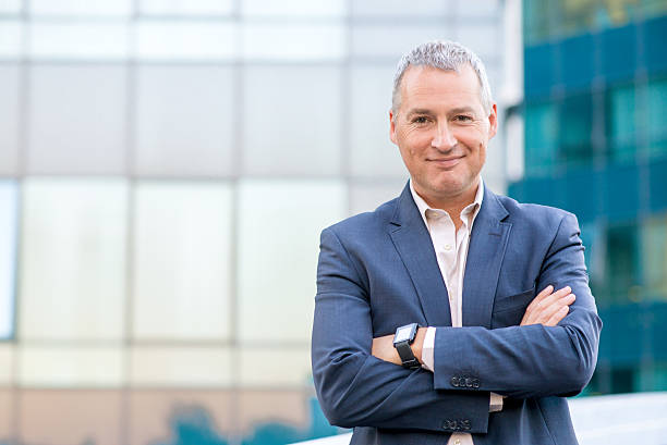 istock Happy satisfied mature businessman looking at camera 612031102