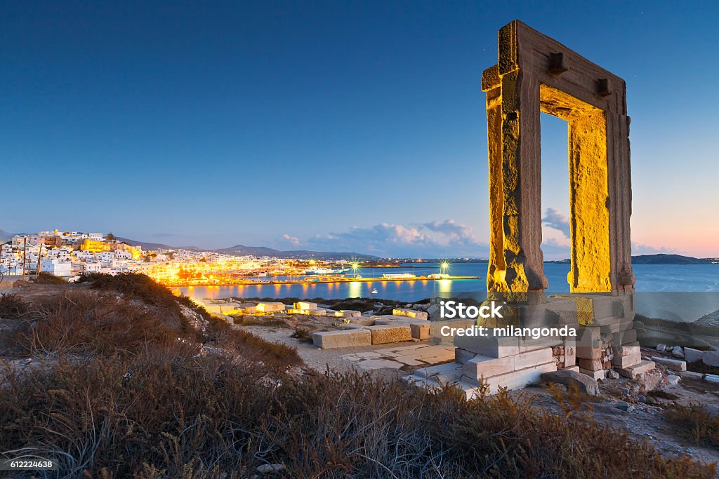 Naxos town. View of Portara and remains of temple of Apollo at sunset. Greece Stock Photo