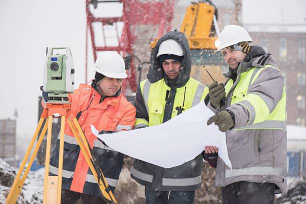 Civil Engineers At Construction Site In Winter stock photo