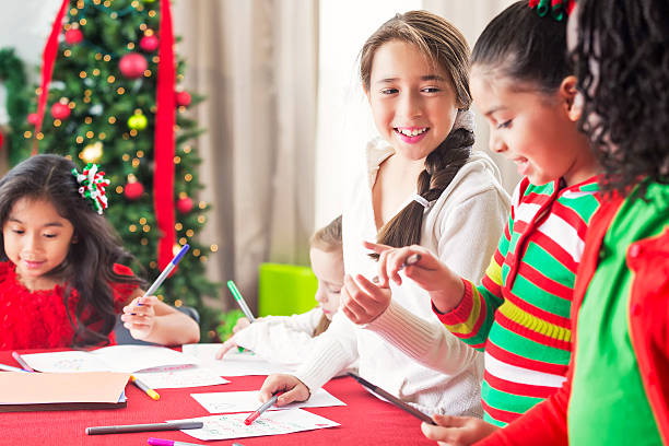 istock Pretty girls work on Christmas charity project 612228724