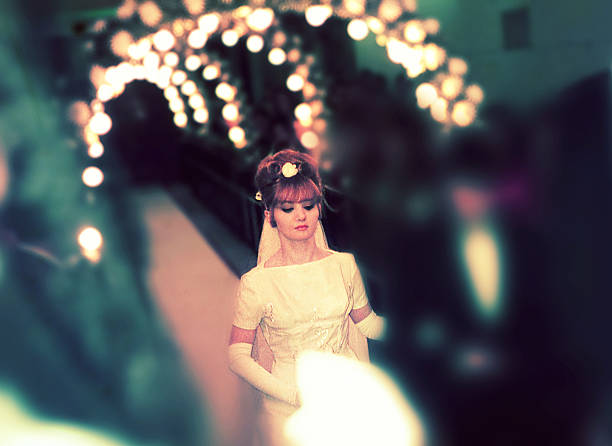 vintagephoto from the sixties of a bride walking down the aisle