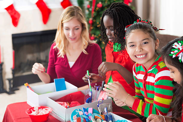 istock Young friends pack shoe boxes for charity 612229470