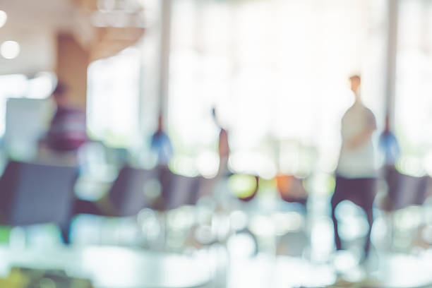 istock Blur background,businessman walking at corridor in hall 612230298