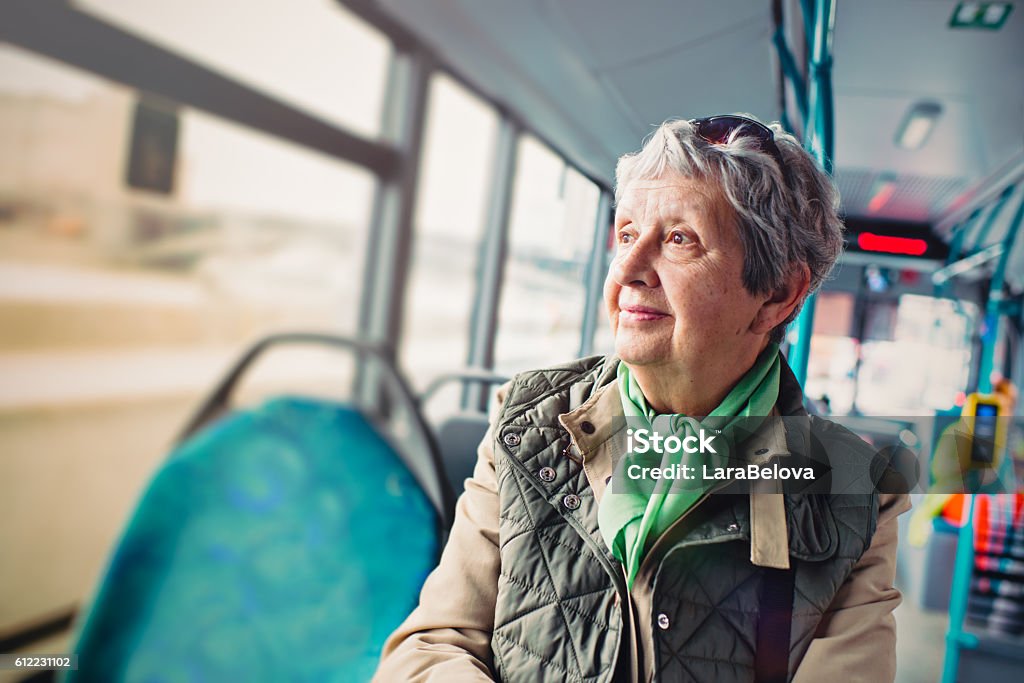 Senior woman in the bus Bus Stock Photo