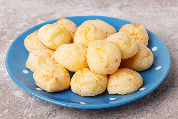 istock Brazilian snack cheese bread (pao de queijo) on plate 612231430