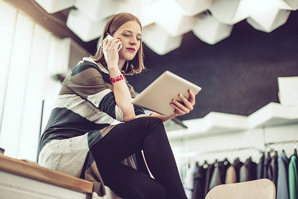 young businesswoman is working in her store - lifestyles designer store luxury imagens e fotografias de stock