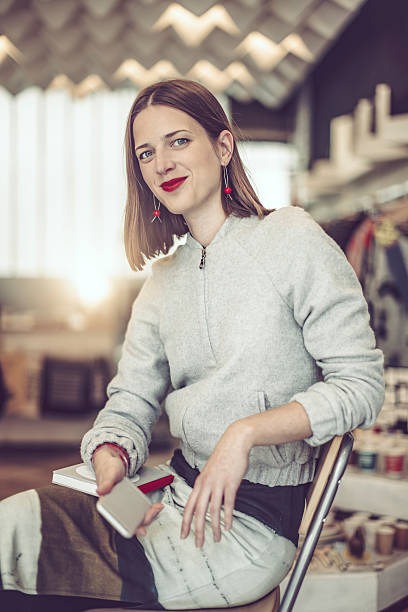 istock Young businesswoman is working in her store 612232856