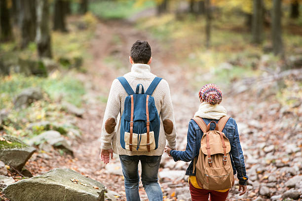 istock Beautiful couple on a walk in autumn forest 612233126
