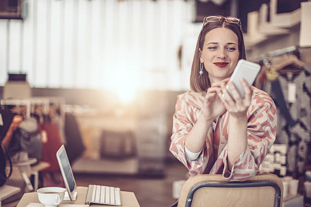 Young businesswoman is working in her store