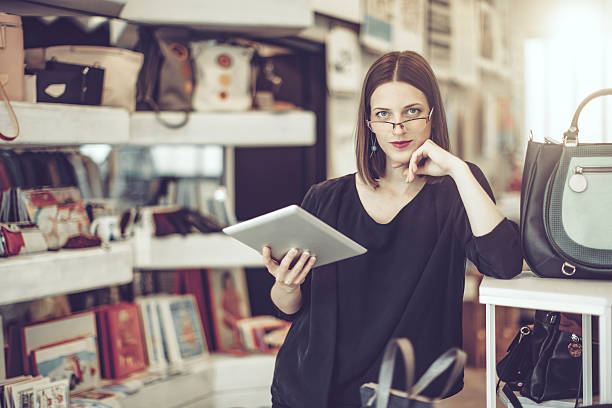istock Young businesswoman is working in her store 612234774