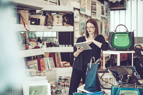 istock Young businesswoman is working in her store 612234868