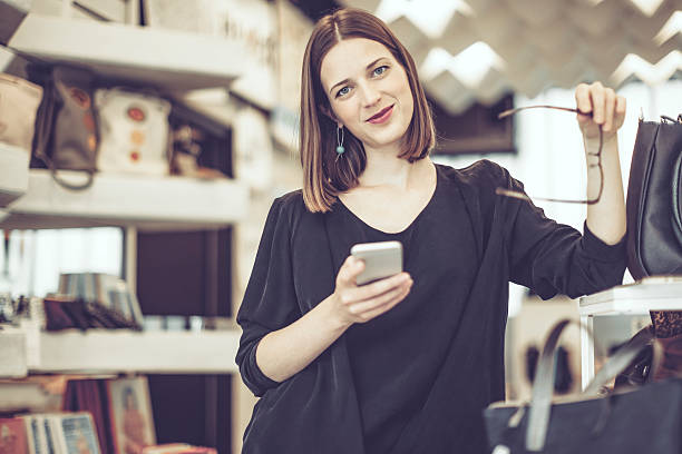istock Young businesswoman is working in her store 612235032