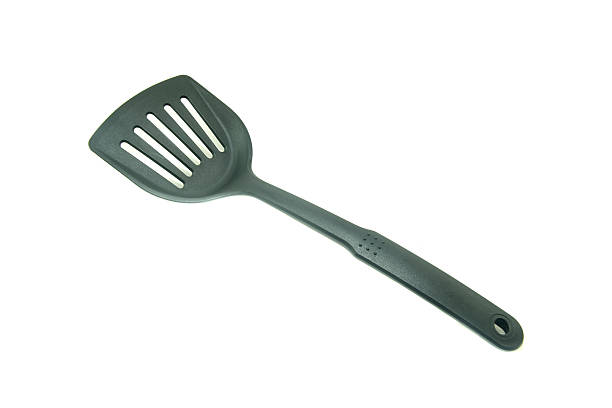 istock spade of frying pan on white background 612235476