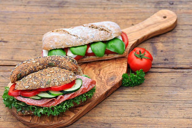 sandwiches  - mozzarella tomato sandwich picnic stock-fotos und bilder