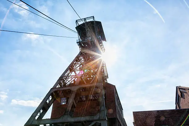 shaft tower of former coal mine Zeche Zollern in Dortmund, Germany, file contains lensflares, taken at sunset