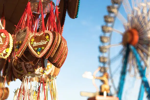 octoberfest gingerbread hearts hanging in front of ferris wheel