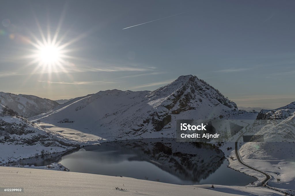 View of Enol lake snowy in winter View on snowy hills near Enol lake, in Asturias, Spain Asturias Stock Photo