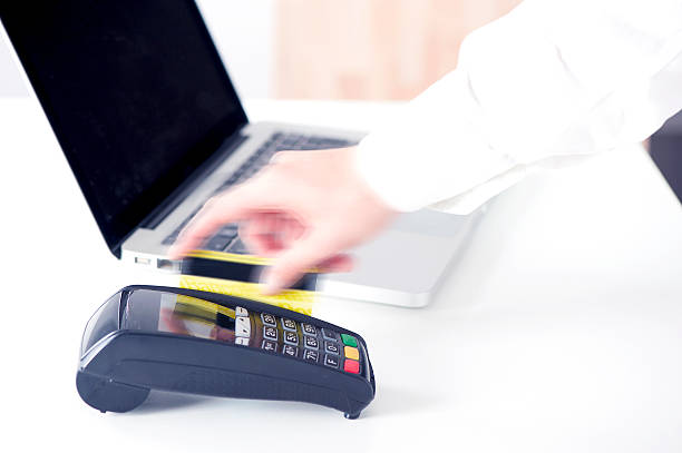 istock Hand Swiping Credit Card 612239974