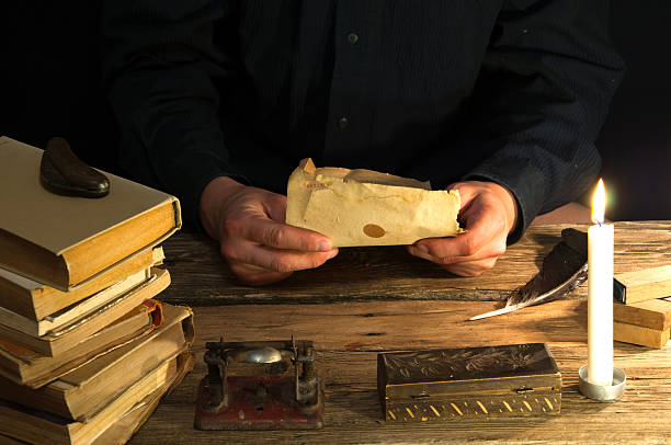 istock Man writing a letter with quill and sealing. Vintage 612241092