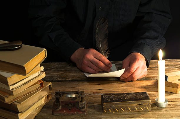 istock Man writing a letter with quill and sealing. Vintage 612241896