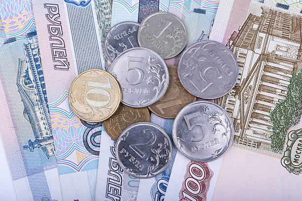 istock Russian rubles banknotes and coins, closeup view 612242898