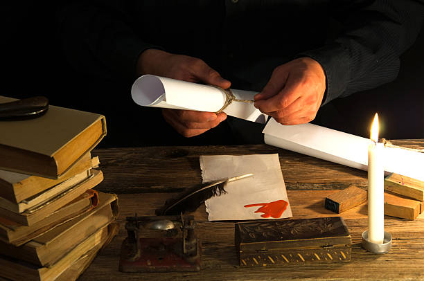 istock Man writing a letter with quill and sealing. Vintage 612243128