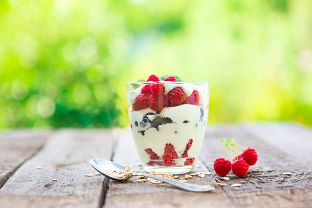 istock Natural yogurt with fresh raspberries, black currant and muesli. 612243362