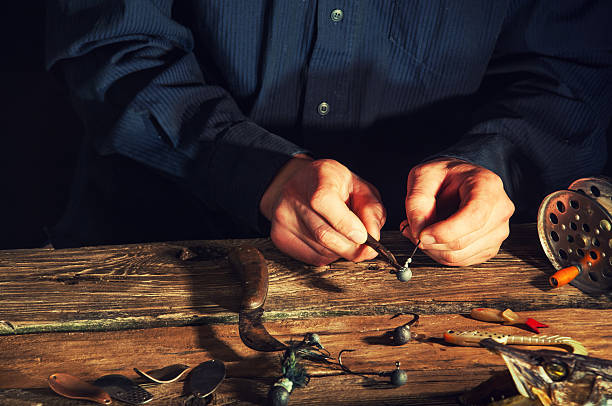 istock Preparation of fishing baits in old vintage workshop 612244002