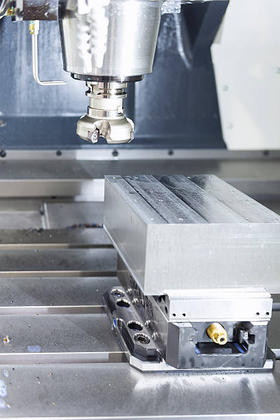 istock The face milling tool with the raw material work piece 612244168
