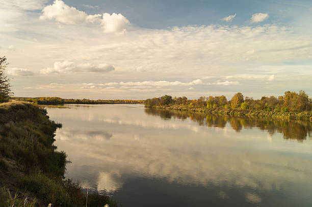 istock Autumn landscape with river on background sky 612245274