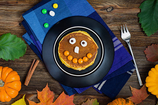 istock Pumpkin pancakes for Halloween breakfast 612247096