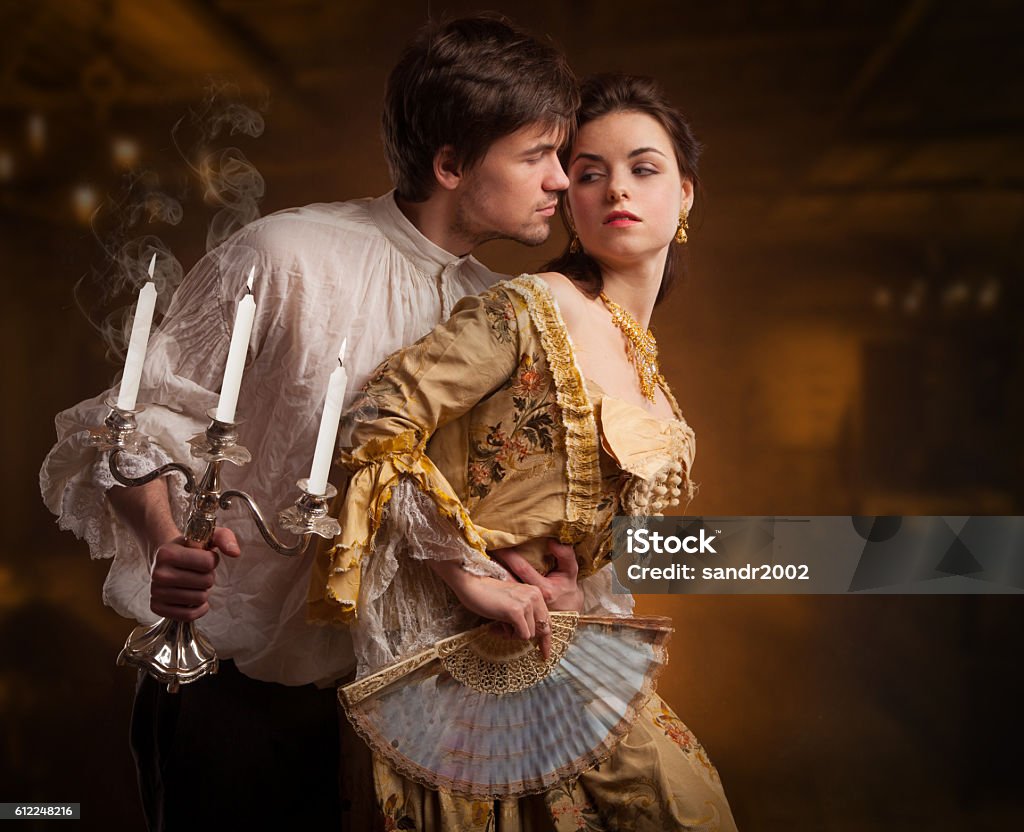 Beautiful couple of vampires dressed in medieval clothing. Beautiful couple of vampires dressed in medieval clothing. book cover Couple - Relationship Stock Photo