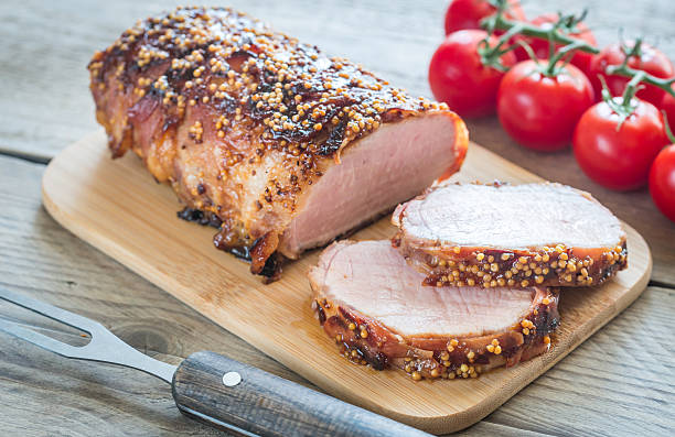istock Baked pork meat wrapped in bacon 612248238