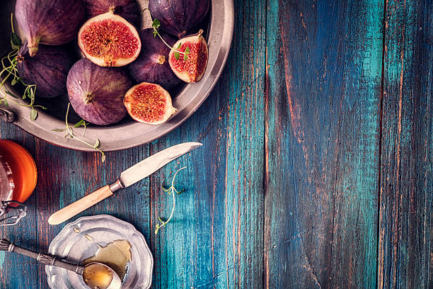 istock Figs and Sweet Honey on Wooden Background 612250930