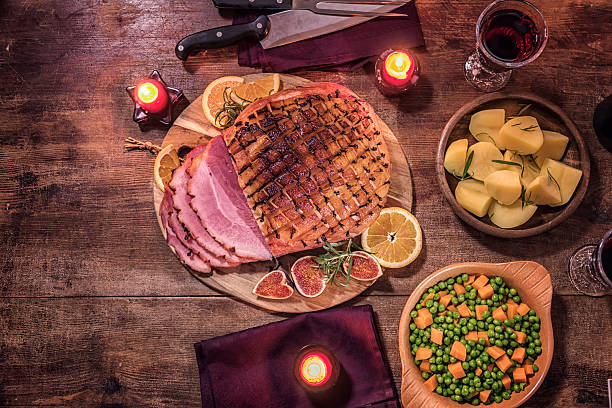 istock Glazed Holiday Ham with Cloves Served for Dinner 612251570