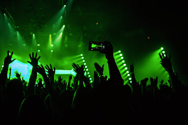 istock Rock concert crowd recording performance with digital smartphone 612252024