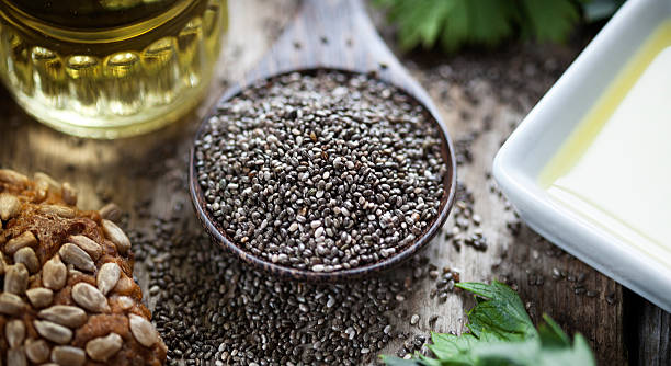 istock Wooden spoon oil chia seeds bread 612254262