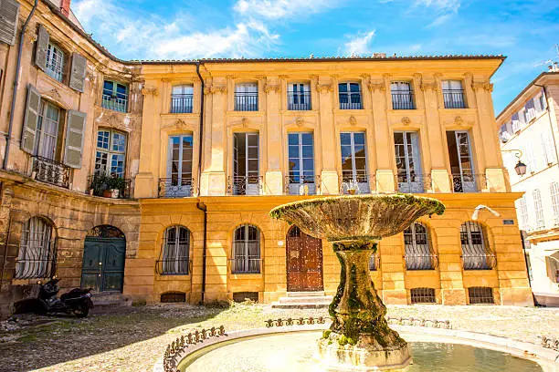 Beautiful old fountain on Albertas square in Aix-en-Provence old town in France. French architecture in Provence