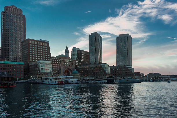 istock Boston Skyline Towers With Purple Clouds 612258184