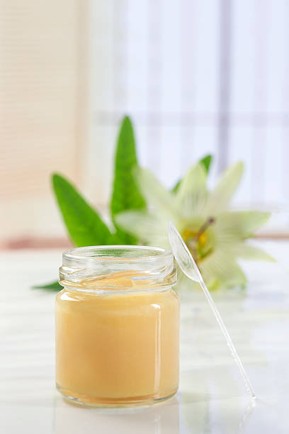 istock raw organic royal jelly in a small bottle with passiflora 612258324
