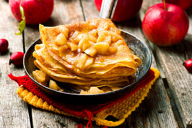 pumpkin crepes with cinnamon apples pumpkin crepes with cinnamon apples crepe stock pictures, royalty-free photos & images
