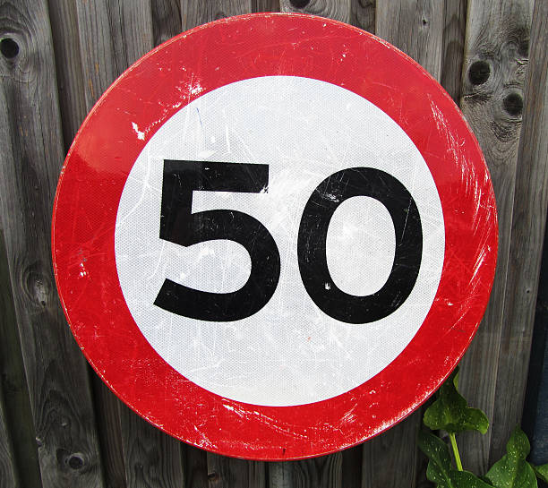 istock speed limit 50 kilometers Traffic Sign isolated. 612258728