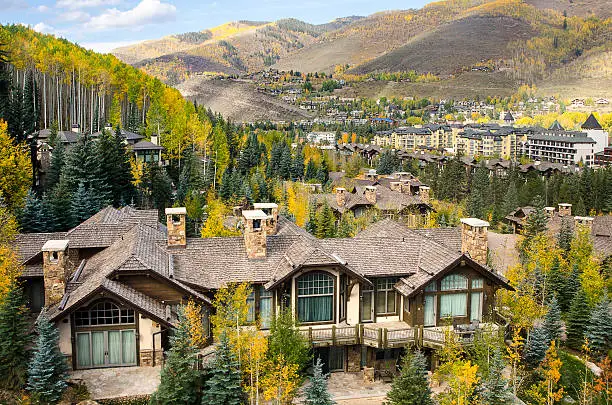 The famous ski village of Vail, Colorado. The village was established and built as the base village to Vail Ski Resort, with which it was originally conceived and is the third largest ski mountain in North America. Vail attracts wealthy visitors, many of whom, who build and purchase vacation homes and condominiums near the ski slopes. Taken in Vail, Colorado in early October.