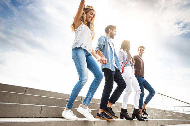 istock Happiness multiracial Friends walking in Barceloneta 612260970