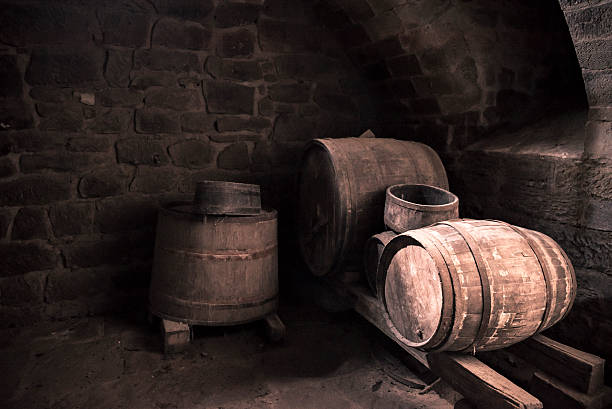 istock Old wine cellar and wooden barrels 612262628