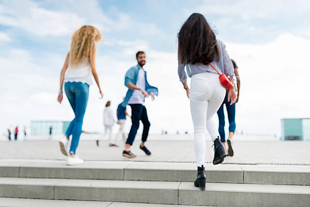istock Happiness multiracial Friends walking in Barceloneta 612262770