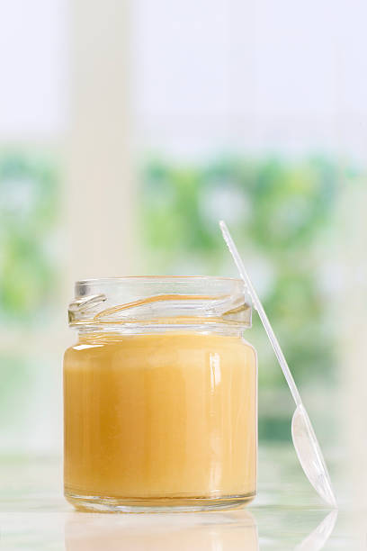 istock raw organic royal jelly in a small bottle 612263980