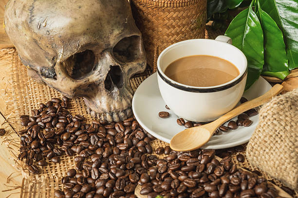istock still life photography, coffee beans with skull 612264310